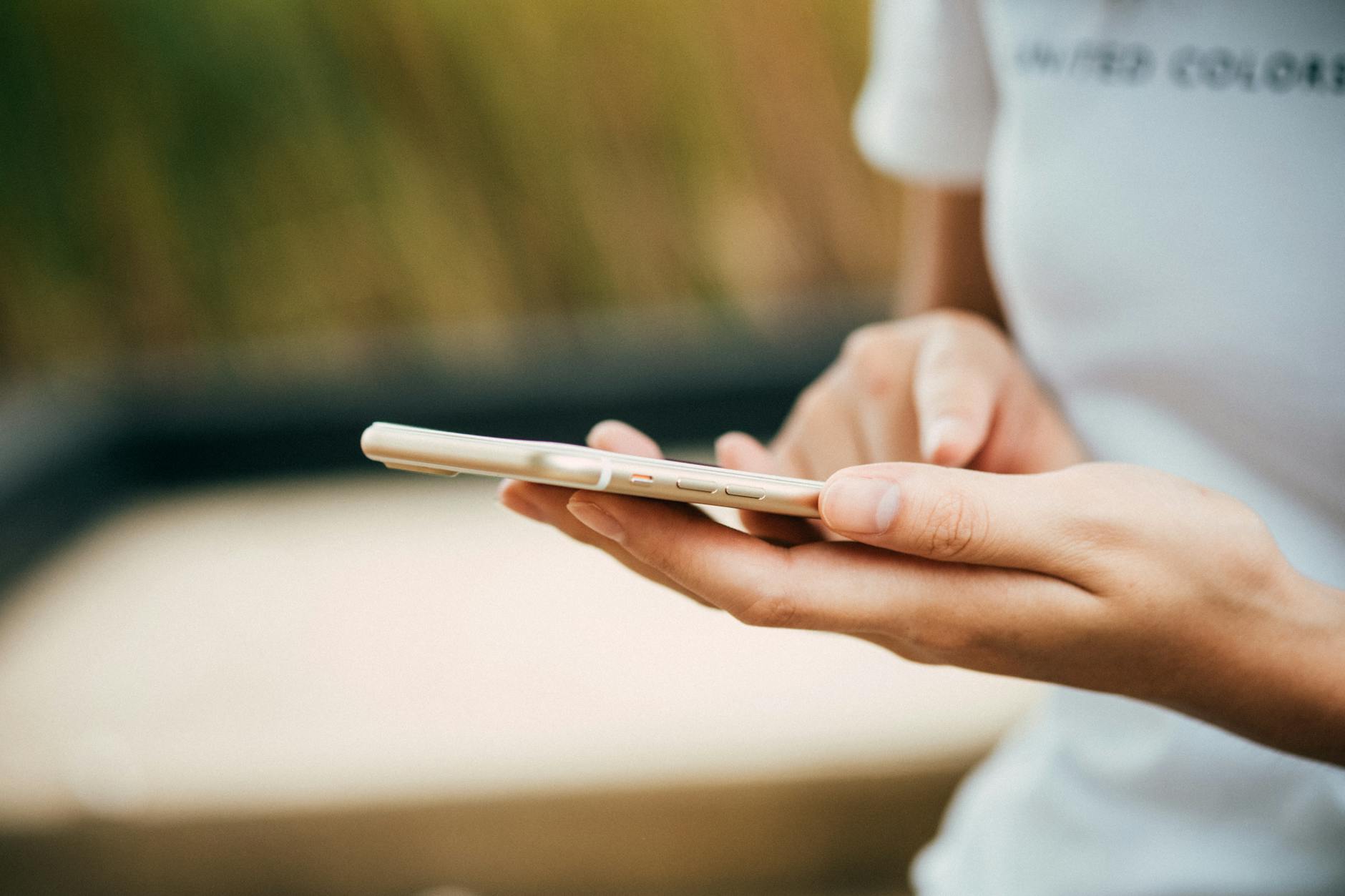 person standing while using phone for short term loan
