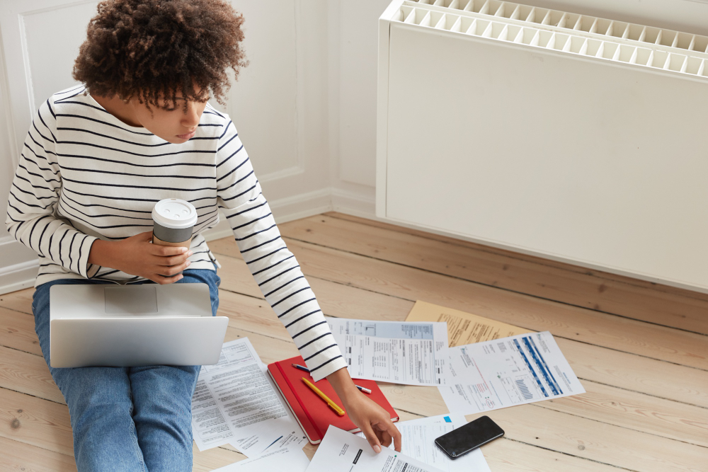 Woman on floor with papers